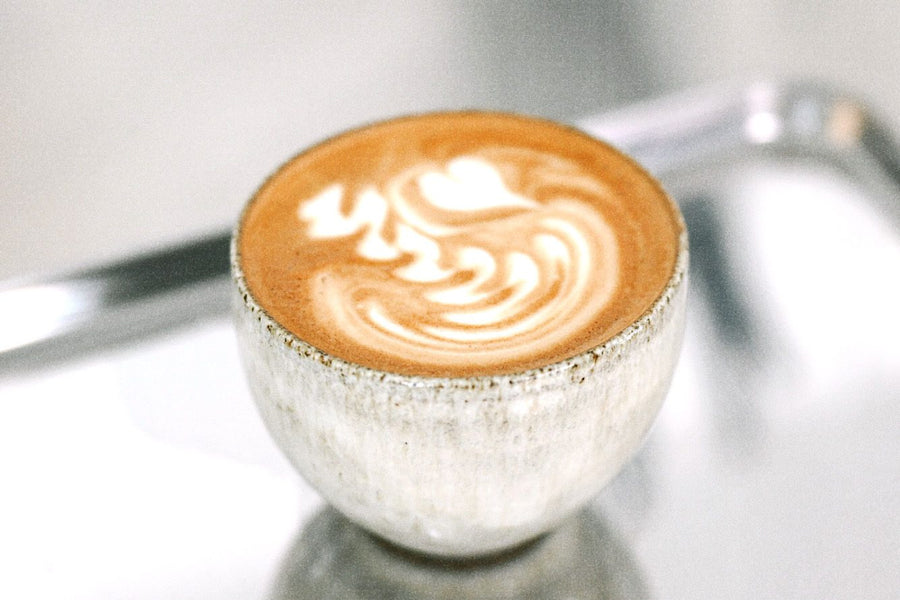 Latte art in a stone cup